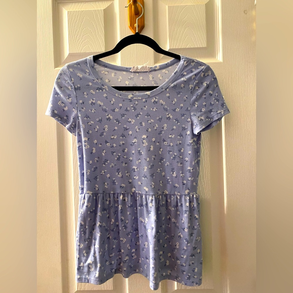 Light blue top decorated with mini flowers with a flowy bottom